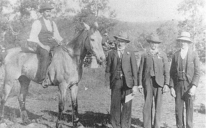 Charlse on a horse, his brother holding the horse
